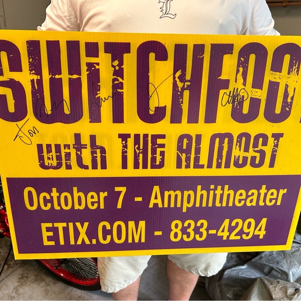 Yellow and Purple Graphic Sign